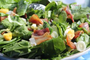 Spinach bacon salad with lemon garlic dressing