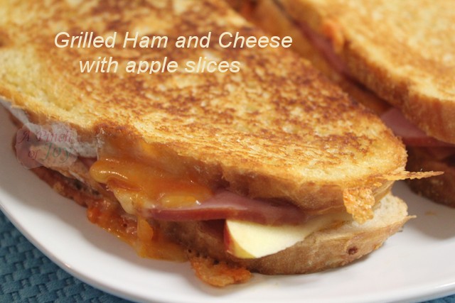 Grilled ham and cheese sandwich with apple