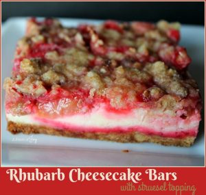 Rhubarb Cheesecake Bars -- A Pinch of Joy Sweet tangy rhubarb on a cheesecake with a nutty crust and struesel topping