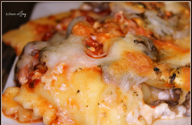 Easy Ravioli and Sausage Lasagna -- A Pinch of Joy Cheesy, flavorful Baked Ravioli Lasagna is busy day casserole that is deliciously filling.