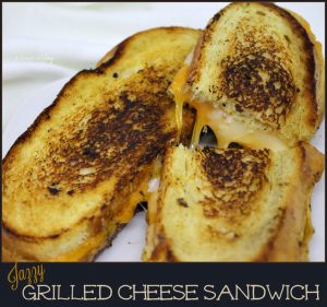Three Cheeses on bread brushed with garlic butter and a whisper of mustard _ Jazzy Grilled Cheese Sandwich A Pinch of Joy