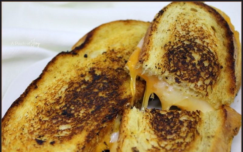 Three Cheeses on bread brushed with garlic butter and a whisper of mustard _ Jazzy Grilled Cheese Sandwich A Pinch of Joy